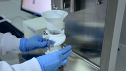 Person attached glass vessel to a scientific instrument